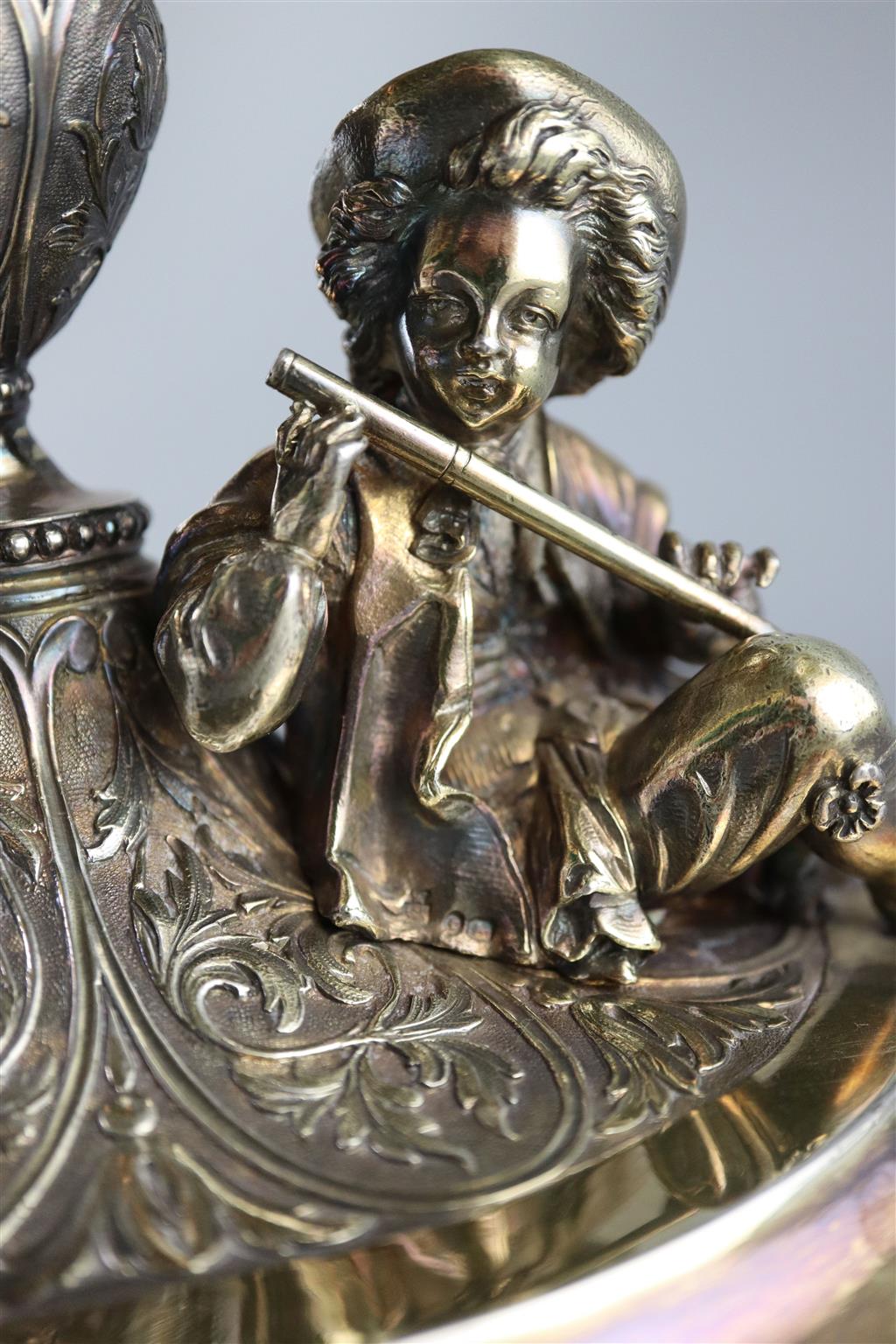 A handsome pair of Victorian parcel gilt silver oval comports by Hunt & Roskell (lacking glass bowls),